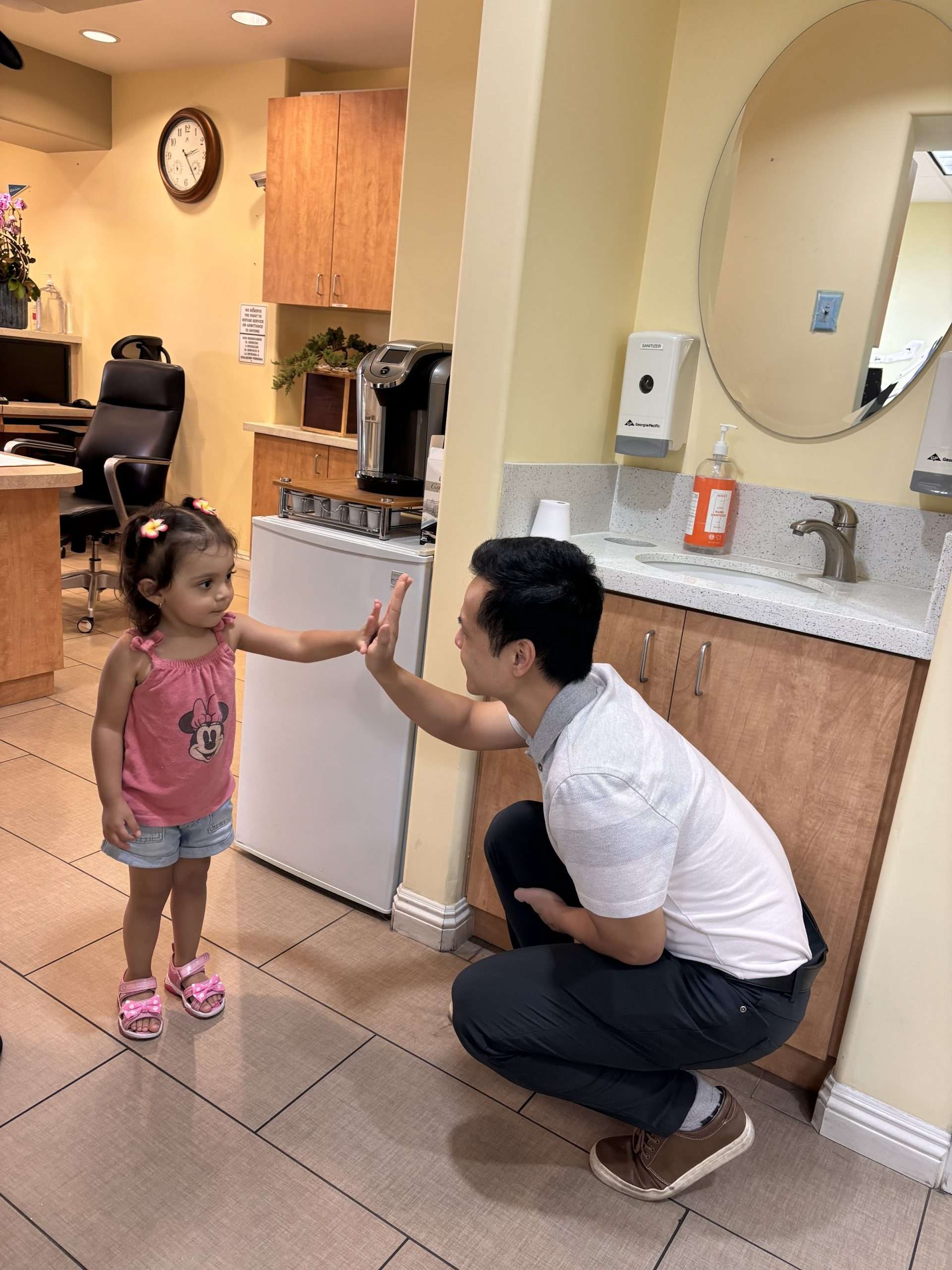dentist giving high five to a patient